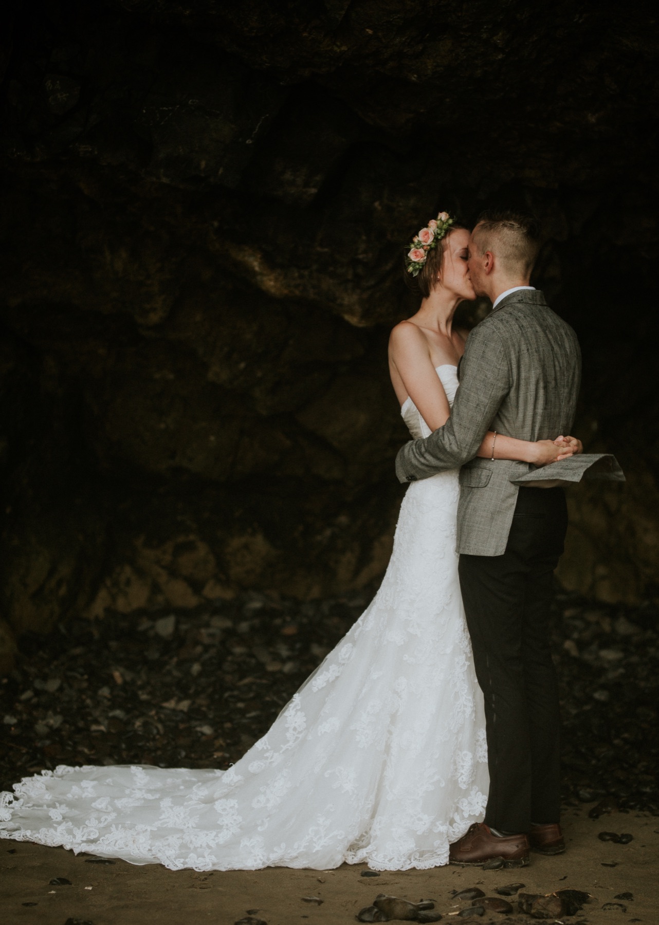 Tasha and Drew kissing inside a sea cave on the Oregon coast.